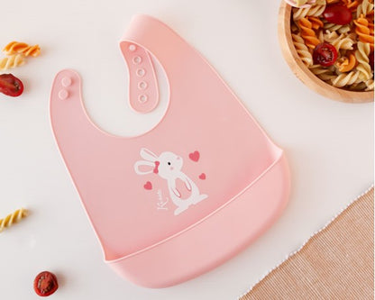 Babero blandito de silicona Conejito/Dino de Kiokids