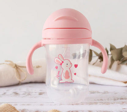 Taza de aprendizaje con asas Dino/Conejito  300 ml de Kiokids